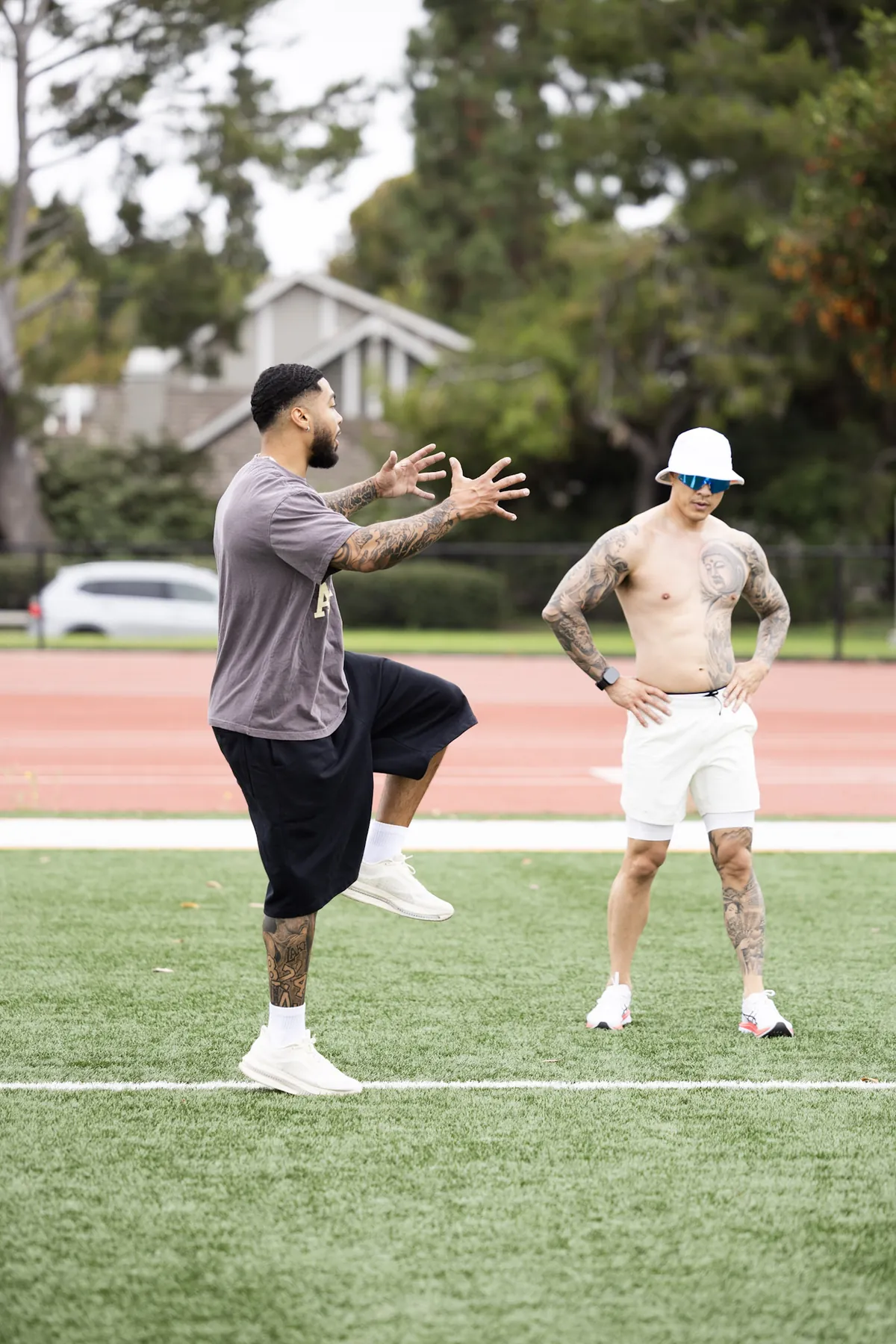 Nate Rodgers coaching a client on a training field